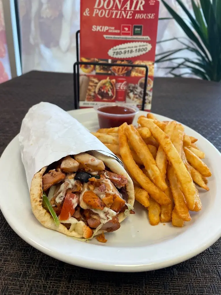 Chicken Donair wrap served with seasoned fries at Donair and Poutine House in Edmonton, AB